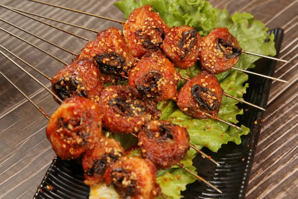 Spicy Pork Skewers Charred Crust Sesame Garnish