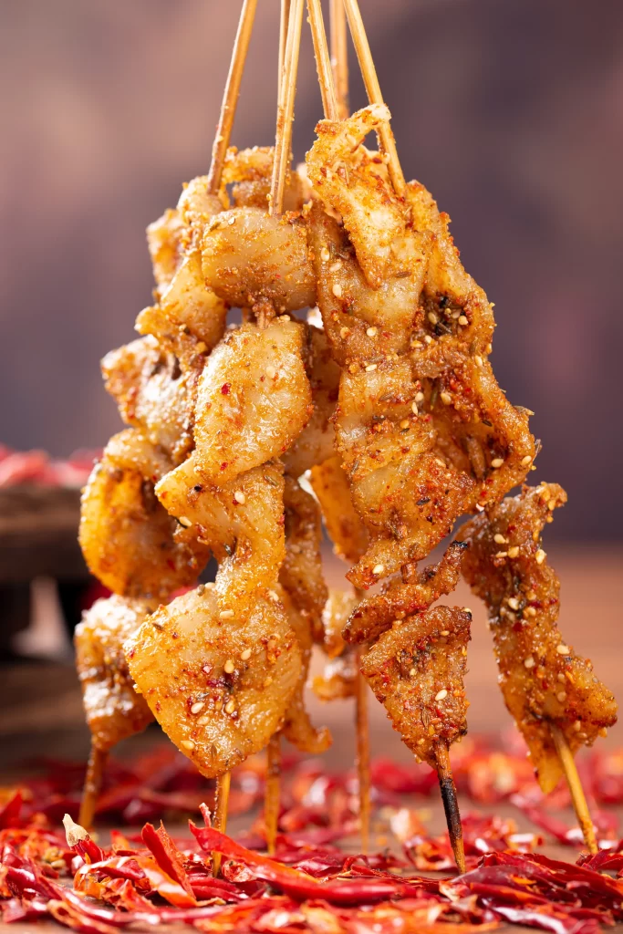 Spicy Pork Skewers Crispy Texture Red Chili Garnish