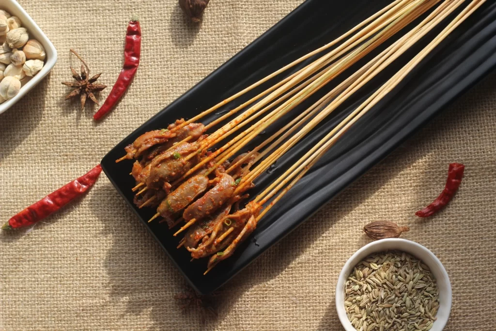 Spicy Pork Skewers Cumin Seeds Red Chili Garnish