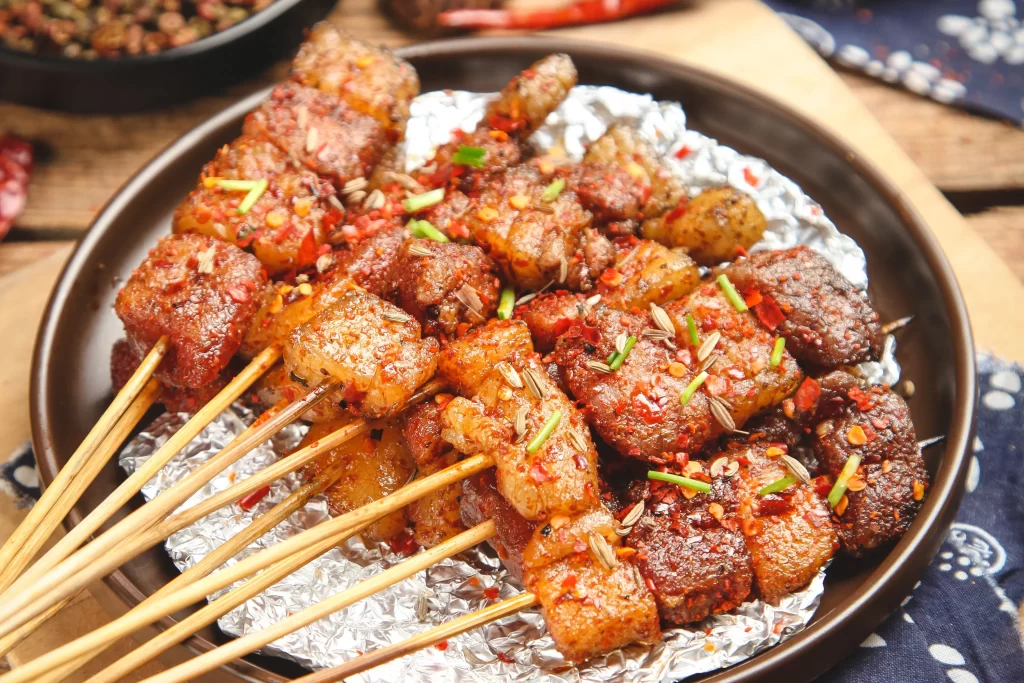 Spicy Pork Skewers Red Chili Garnish Crispy Char