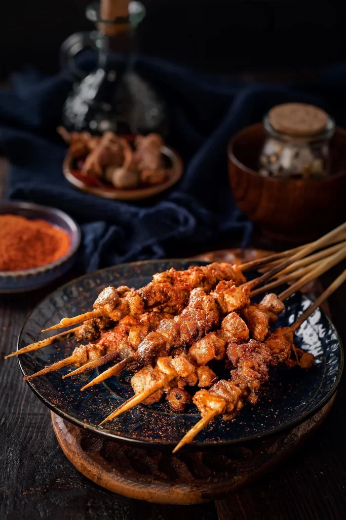 Spicy Pork Skewers Red Chili Powder Crispy Texture Dark Plate