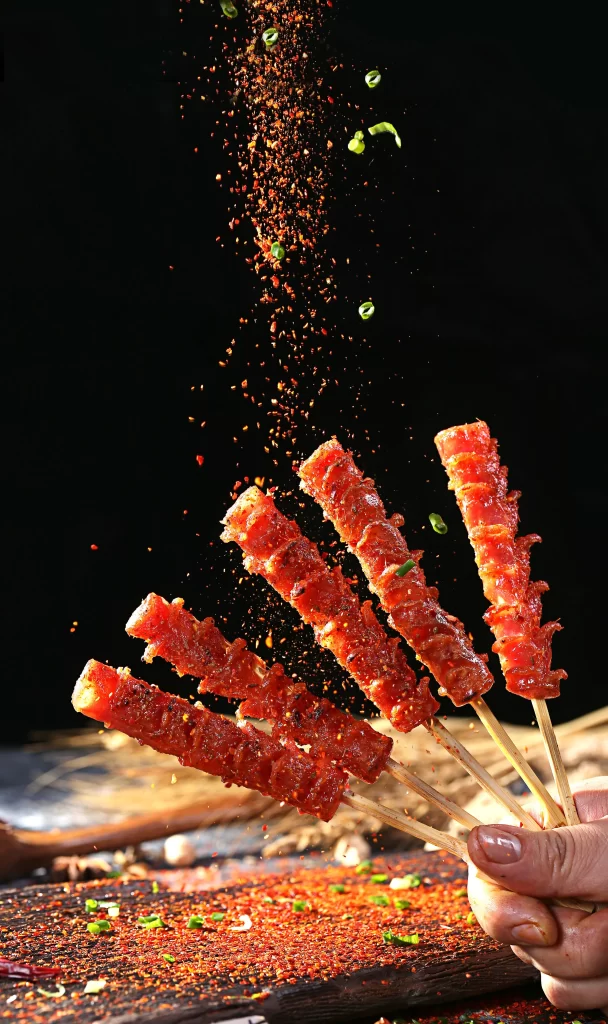 Spicy Pork Skewers Red Chili Powder Green Onion Garnish