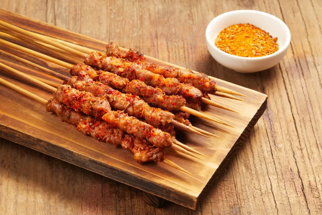 Spicy Pork Skewers Red Chili Powder Wooden Platter