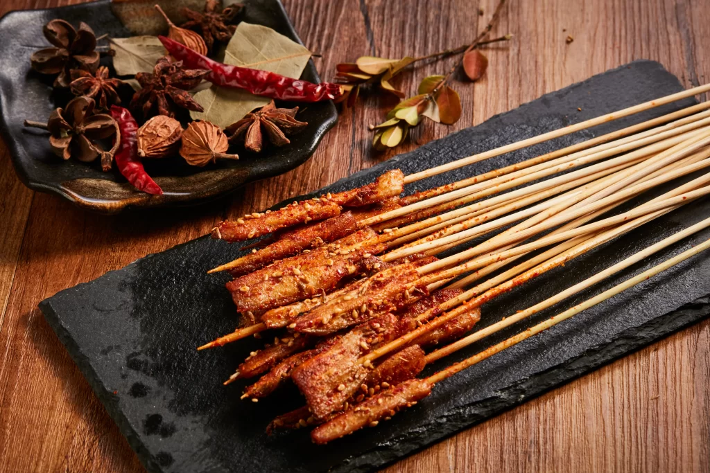 Spicy Pork Skewers Red Chili Sesame Seeds Black Slate