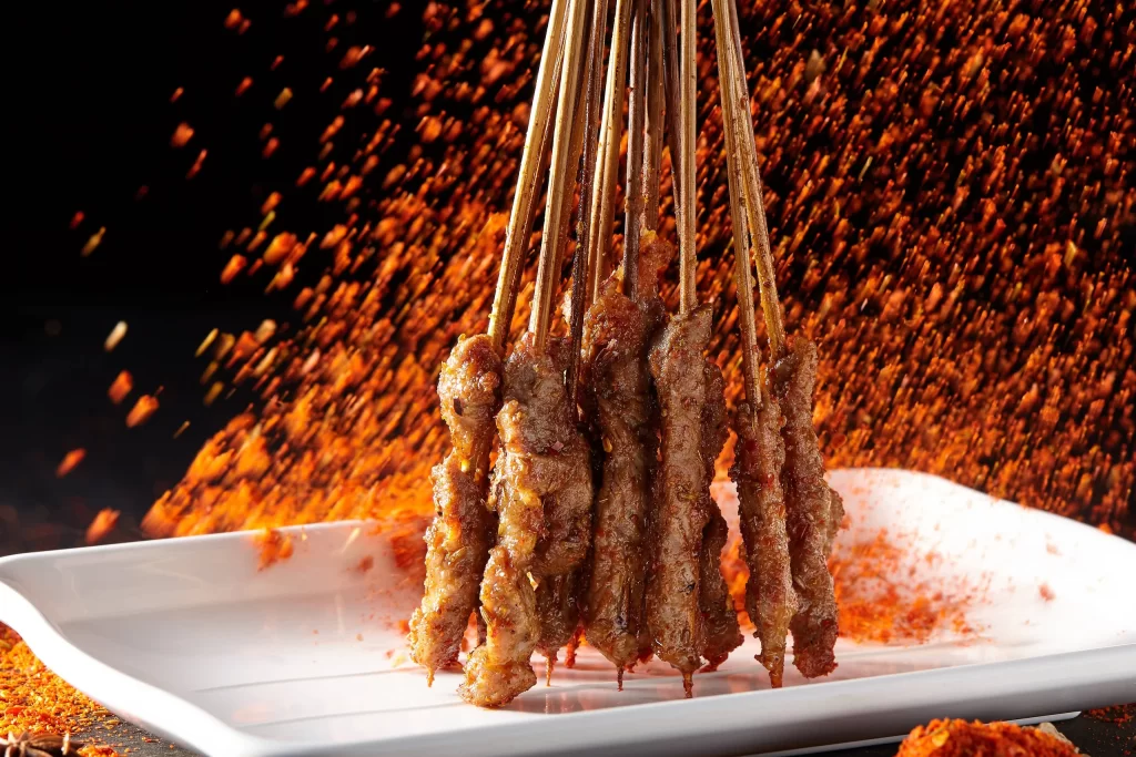 Spicy Pork Skewers Red Pepper Flakes Golden Brown Plate