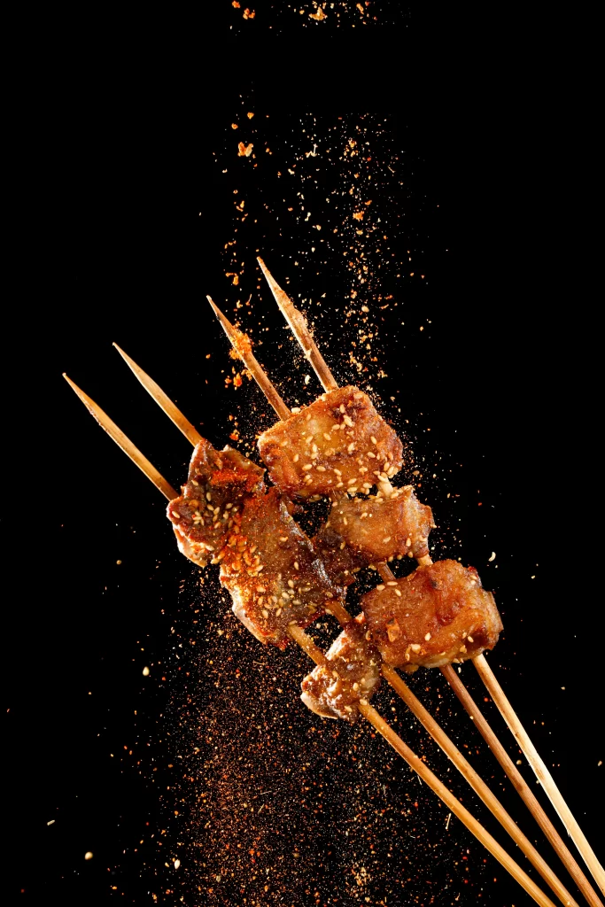 Spicy Pork Skewers Sesame Seeds Charred Crust
