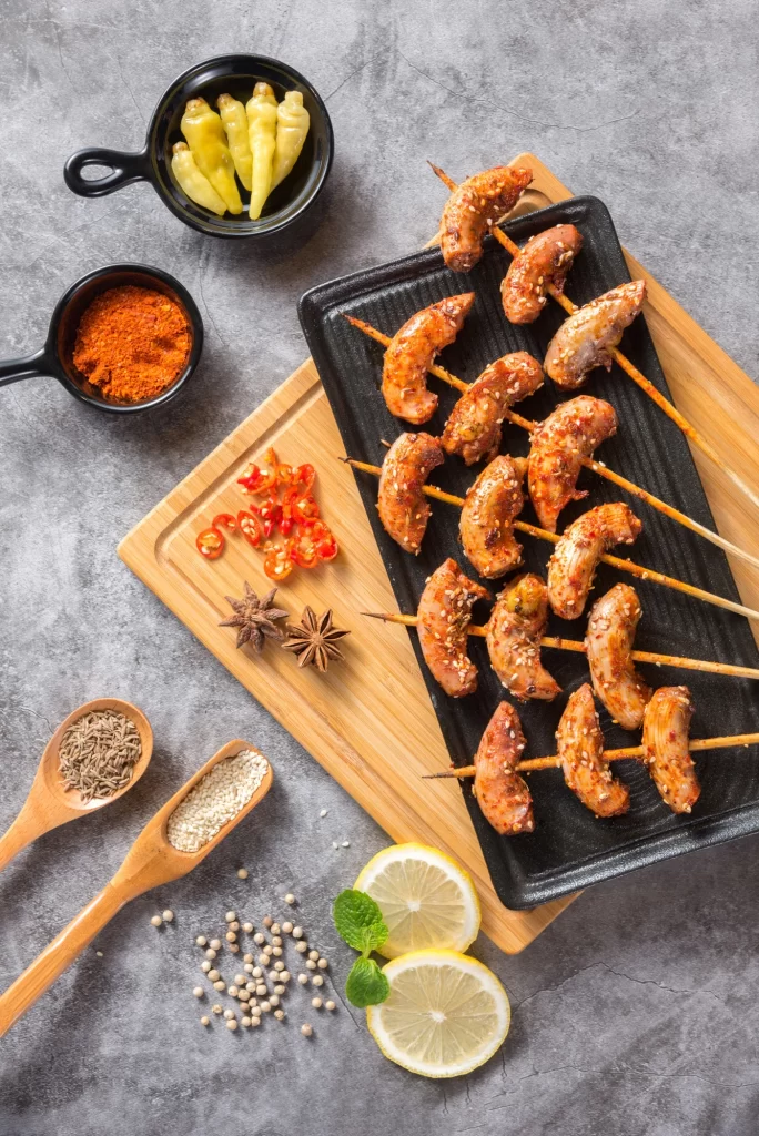 Spicy Pork Skewers Sesame Seeds Charred Edges Plated