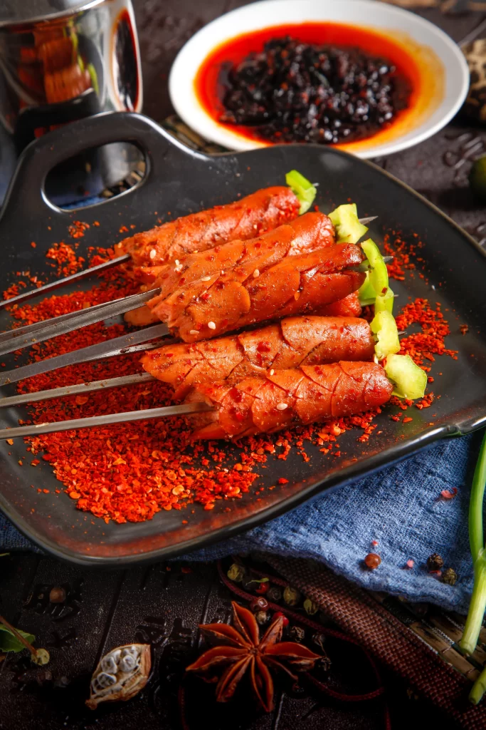 Spicy Pork Skewers with Green Pepper Garnish