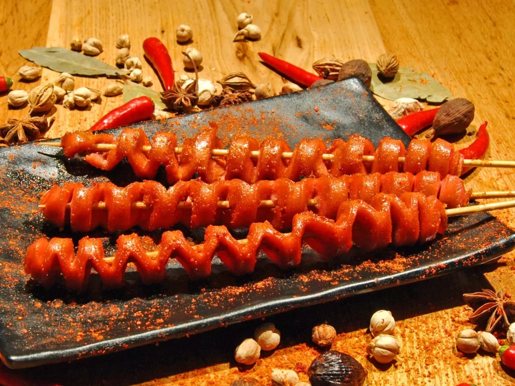 Spiral Sausage Skewers Spicy Seasoning Black Plate