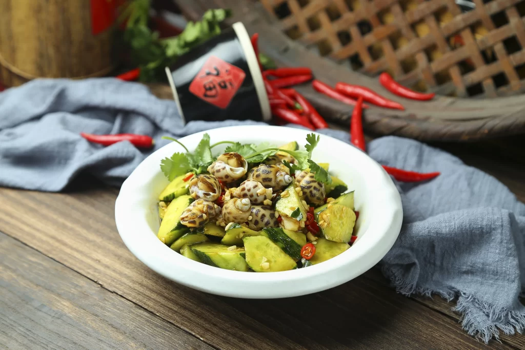 Stir-Fried Snails Cucumber Chili Fresh Herbs White Bowl