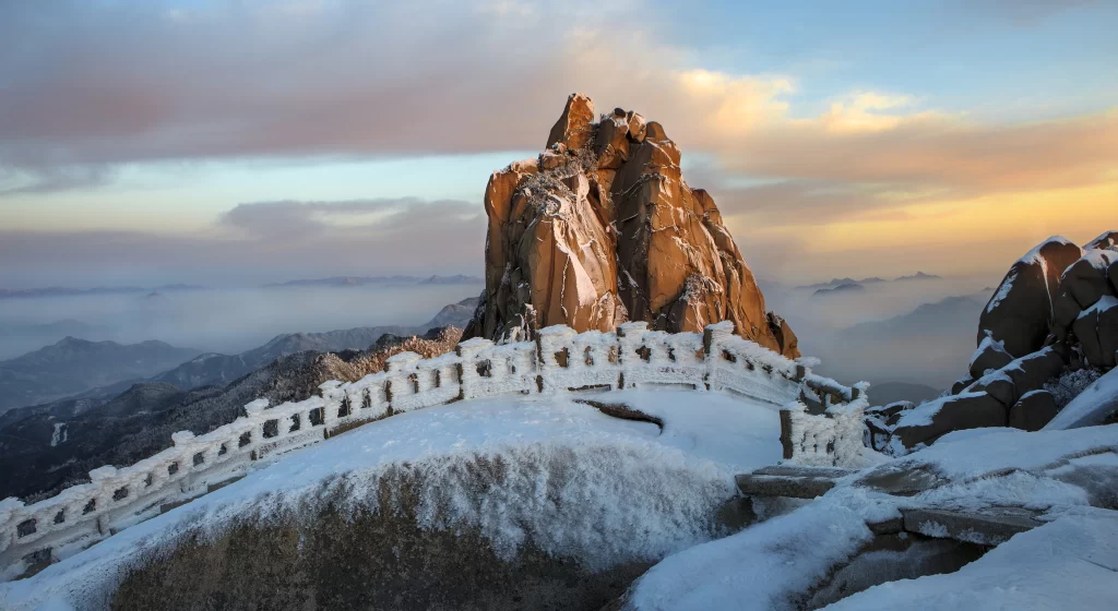 sunset golden amber ridge snow peak clouds panoramic