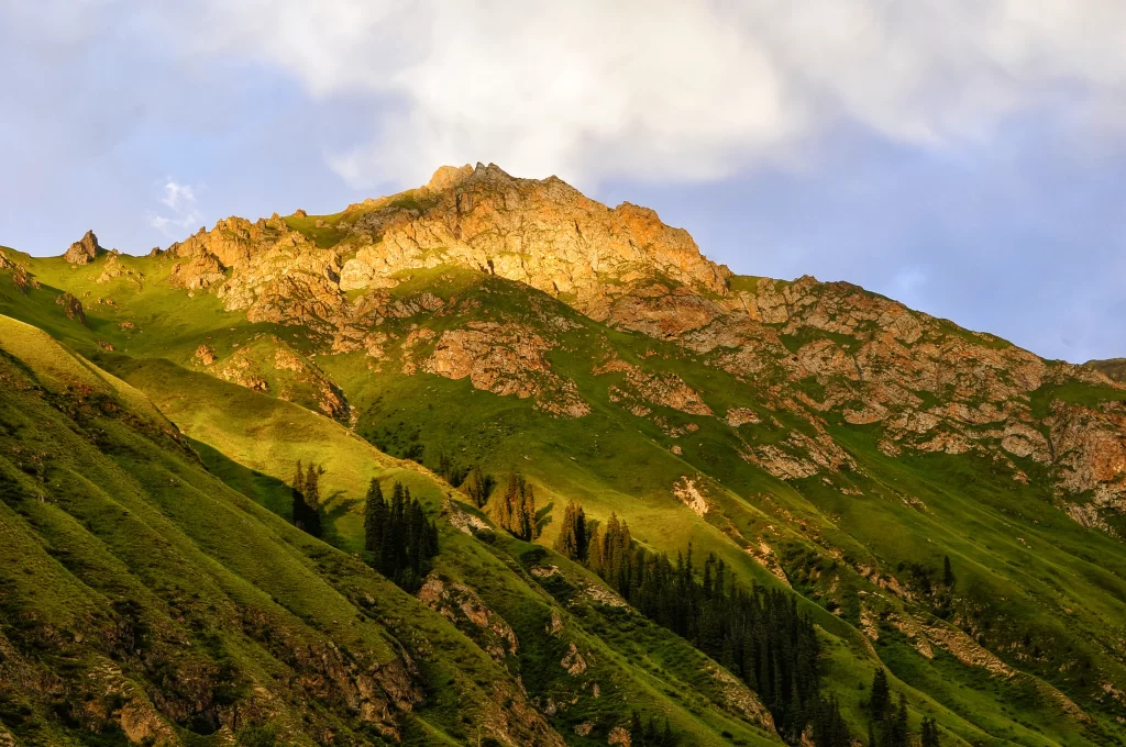 sunset golden amber ridge valley grassland clouds cyan