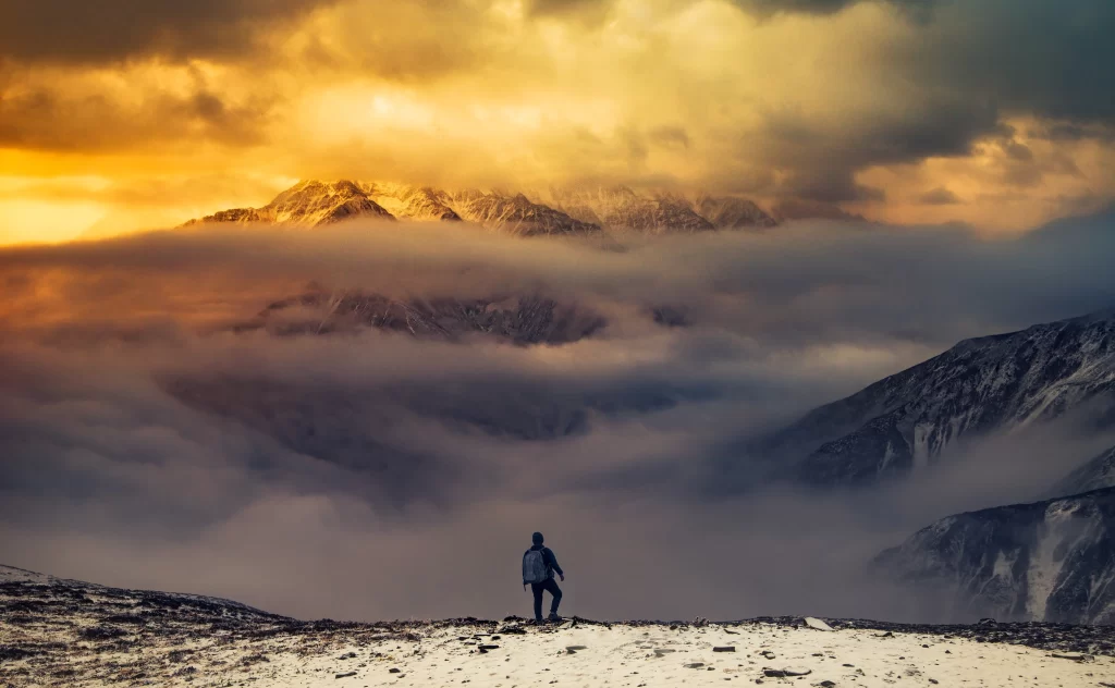 sunset golden amber snow peak clouds ridge panoramic