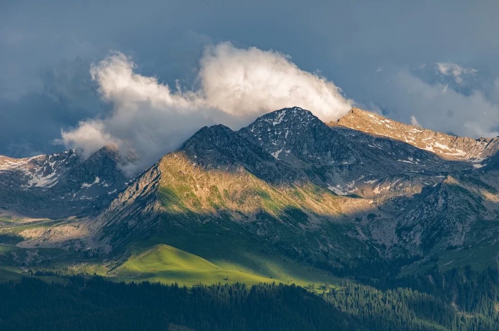 sunset golden amber snow peak ridge valley clouds cyan