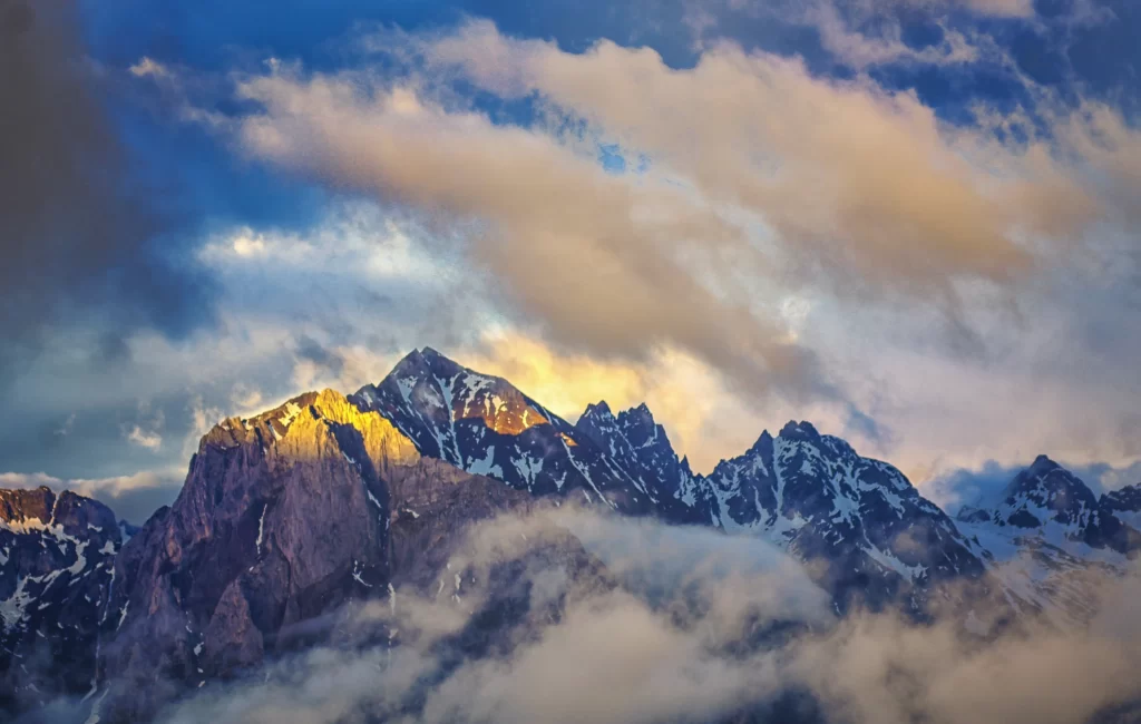 sunset golden amber snow peak ridge clouds panoramic cyan