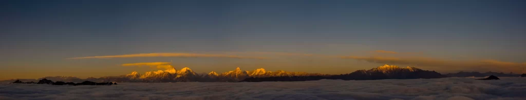 sunset golden amber snow peak ridge clouds panoramic crimson