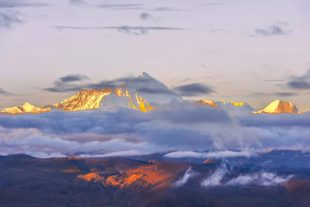 sunset golden amber snow peak ridge clouds valley panoramic