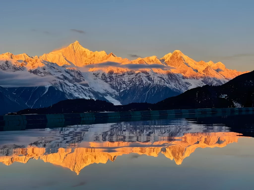 sunset golden orange blue snow-capped reflection tranquil serene