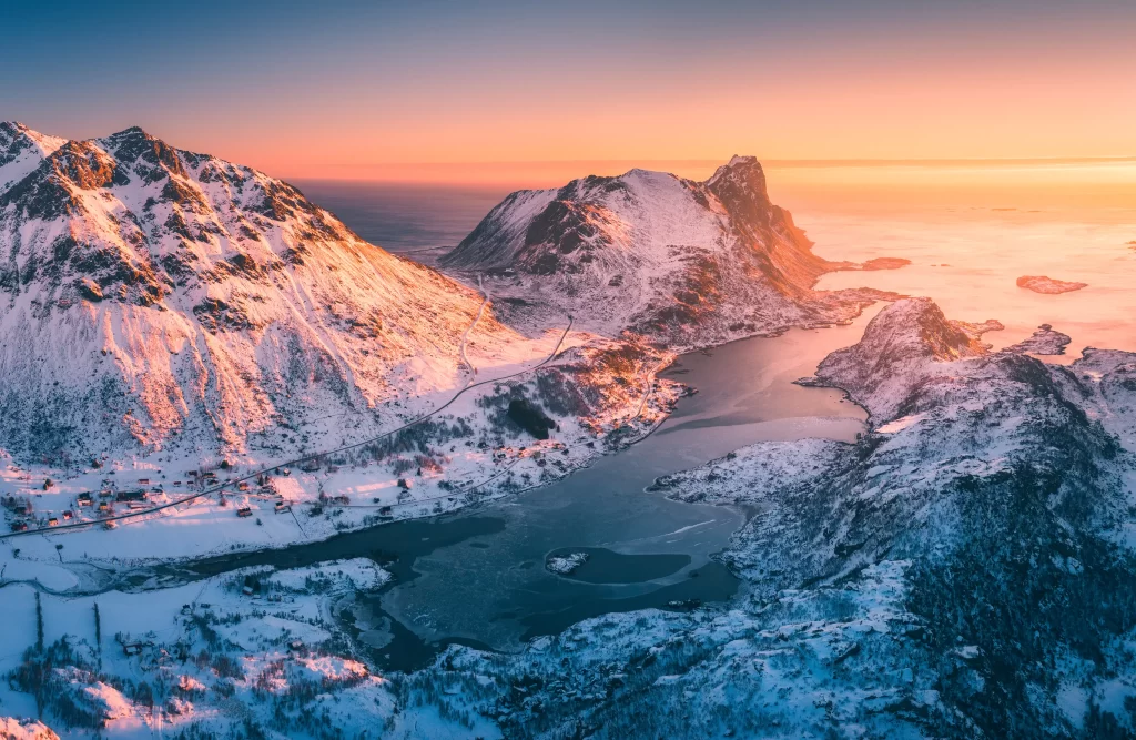 sunset golden orange pink teal blue snow peak ridge lake