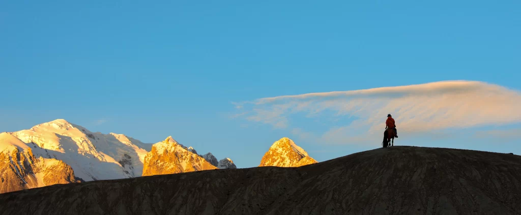 sunset golden orange red snow peak ridge clouds panoramic