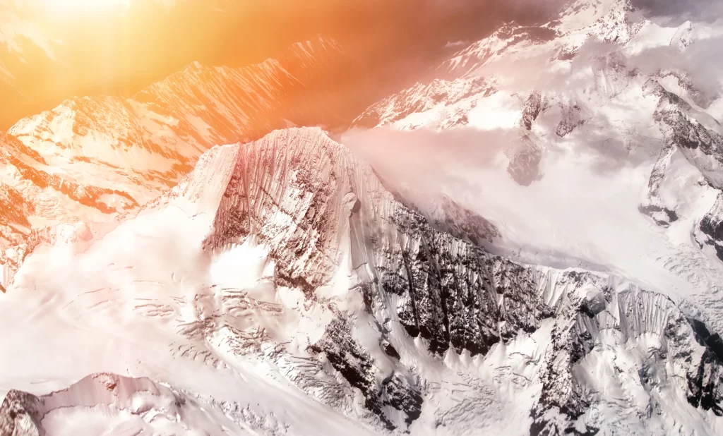 sunset golden orange snow peak ridge aerial