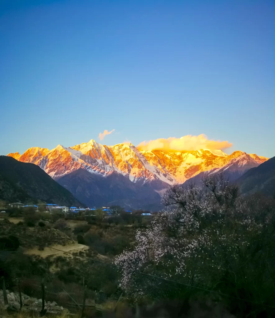 sunset golden orange snow peak ridge valley grassland clouds