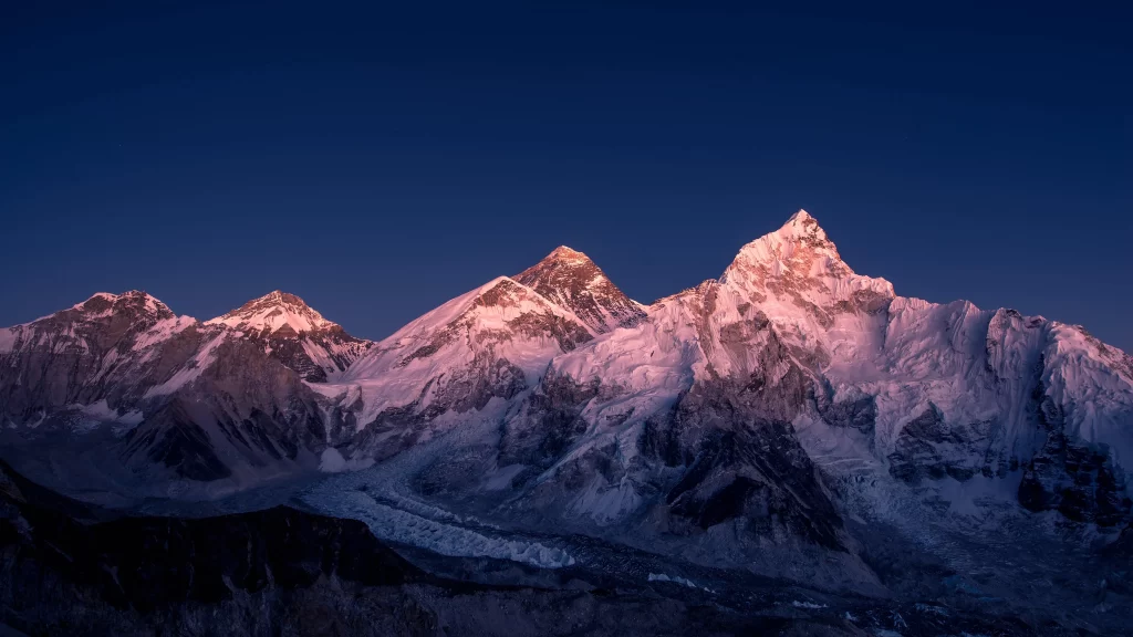 sunset golden snow peak ridge teal blue purple panoramic