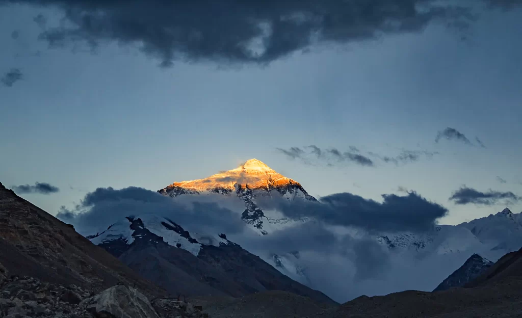 sunset golden snow peak ridge clouds twilight blue purple