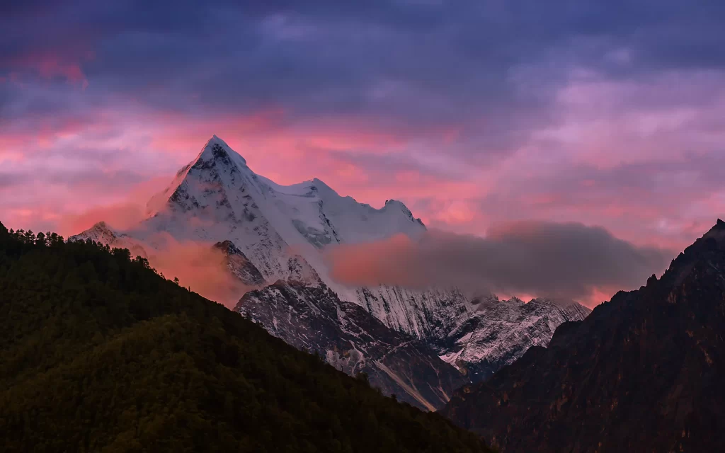 sunset pink purple orange snow-capped clouds mountain peaks forest tranquil