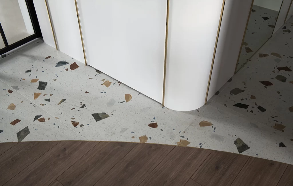 Terrazzo Floor White Walls Wood Accents Neutral Tones