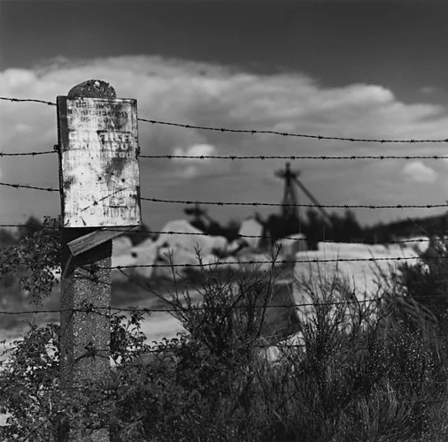 Barbed Wire Fence Signage Weathered Textured High Contrast Mysterious Landscape
