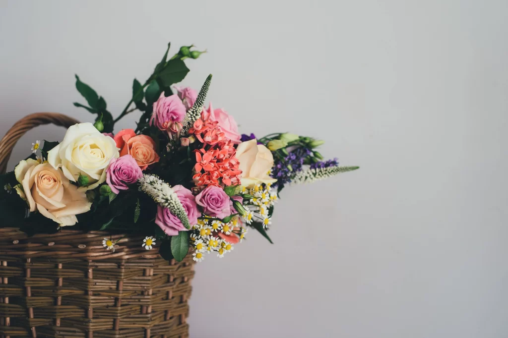 Pink Roses Peach Flowers White Daisies Purple Blooms Green Leaves Basket