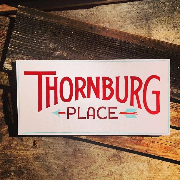 Signage Red White Wood Thornburg Place