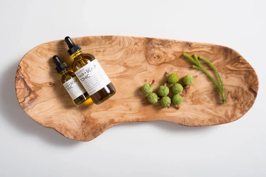 Wooden Tray Green Berries Brown Bottle