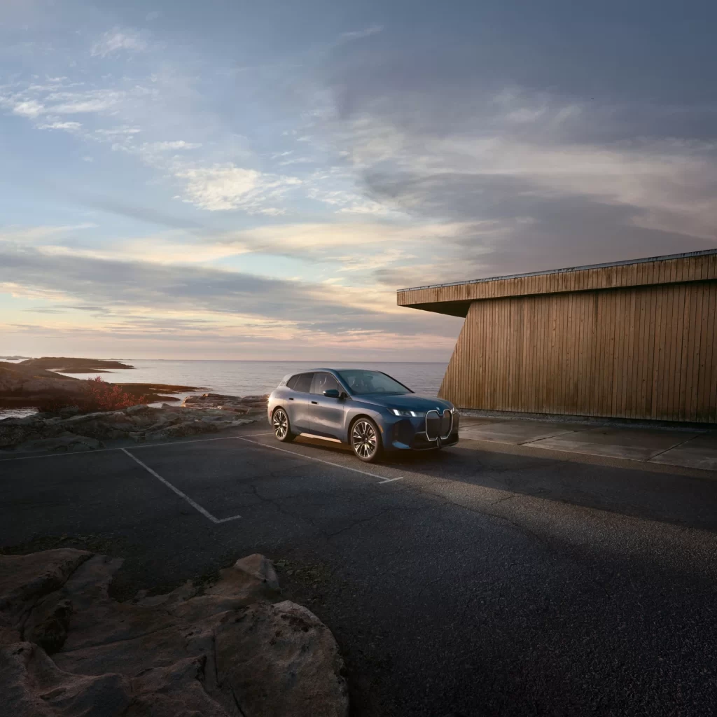 BMW iX Blue Track Side Dynamic View