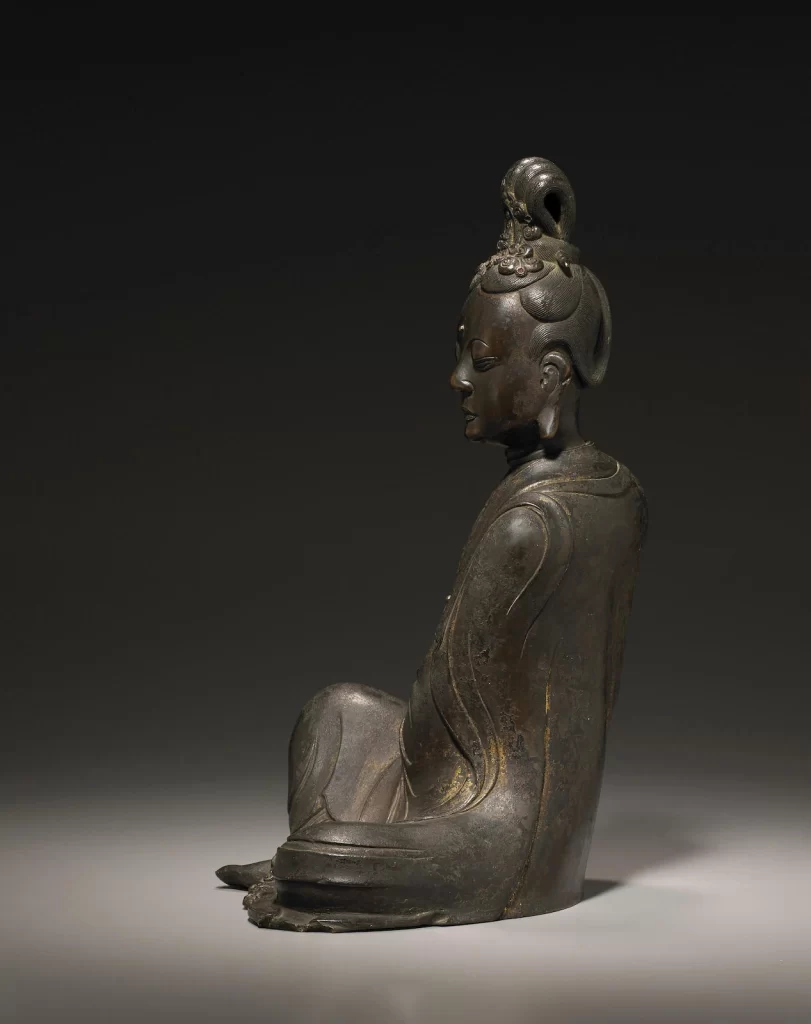 Bronze Seated Figure Statue Dark Background