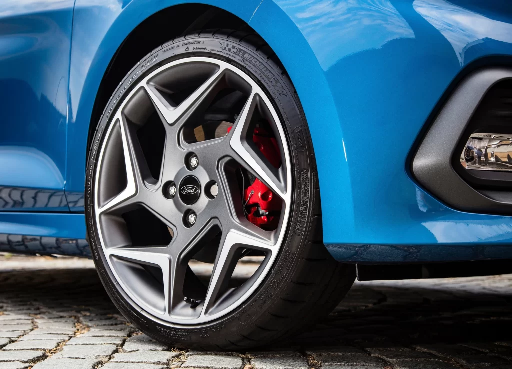 Blue Sedan Street Side View Detail