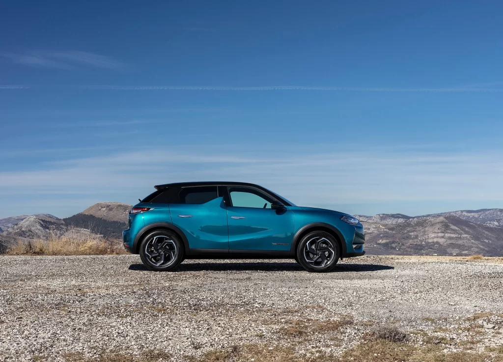 Mini Teal SUV Gravel Road