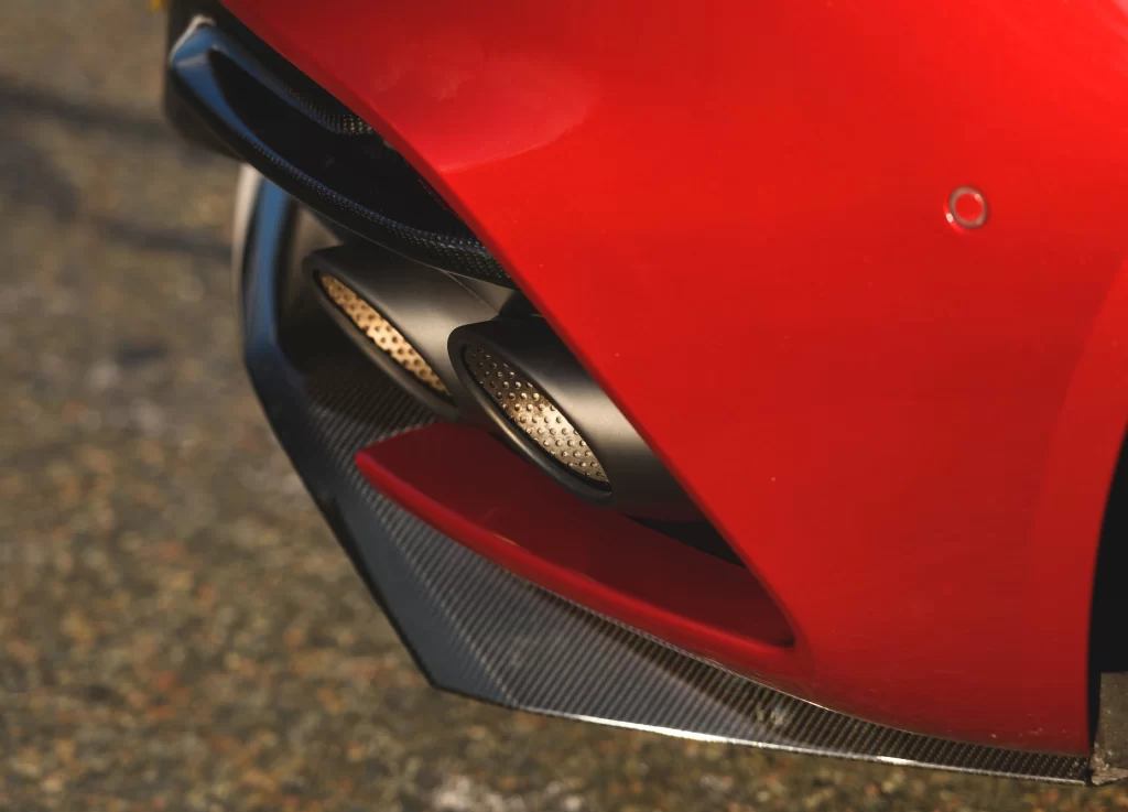 Red Car Exhaust Pipes Carbon Fiber Detail