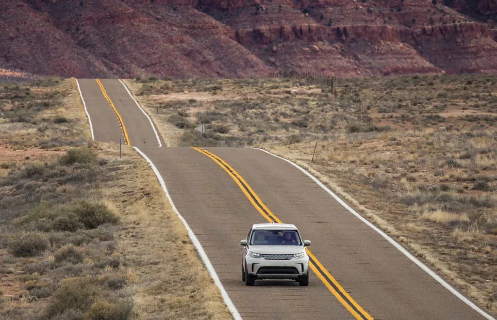 White SUV Desert Road Drive