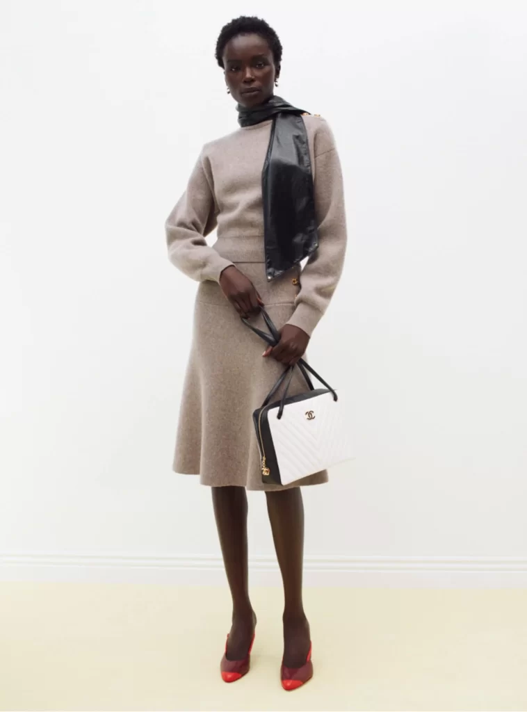 Chanel Fall Winter 2026 Pre Collection Look 45 Knit Cardigan and Skirt Beige and Black Runway Photography