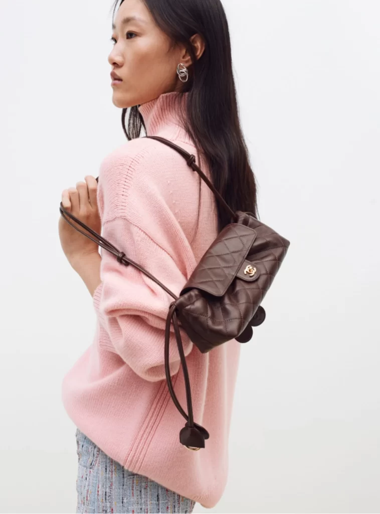 Chanel Fall Winter 2026 Pre Collection Look 47 Knit Pullover and Jeans Pink and Blue Runway Photography