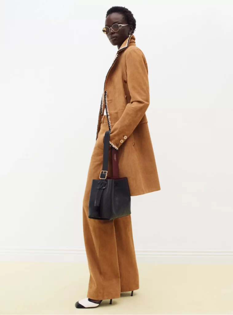 Chanel Fall Winter 2026 Pre Collection Look 24 Tweed Jacket and Trousers Brown and Black Runway Photography