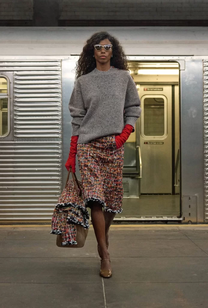Chanel Metiers d’Art 2026 Look 46 Tweed Jacket and Skirt Gray Runway Photography