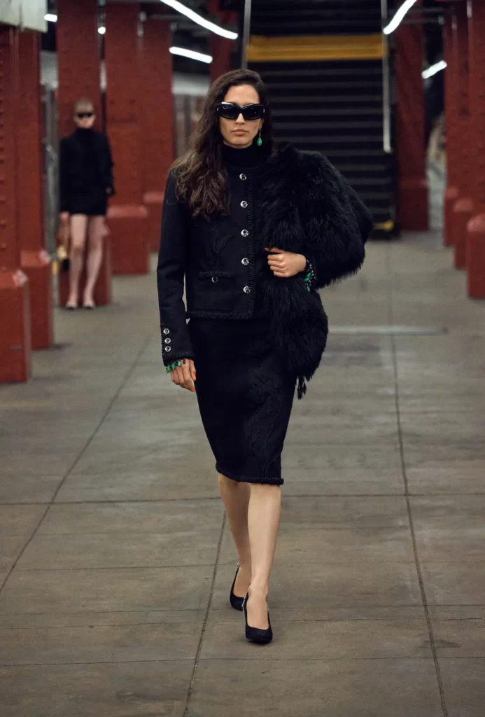 Chanel Metiers d’Art 2026 Look 62 Tweed Jacket and Skirt Black Runway Photography