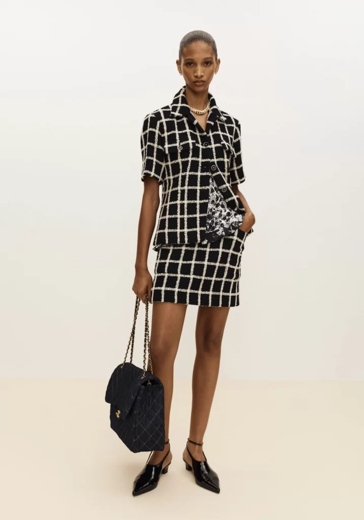 Chanel Spring Summer 2026 Pre Collection Look 25 Tweed Jacket and Skirt Black and White Runway Photography