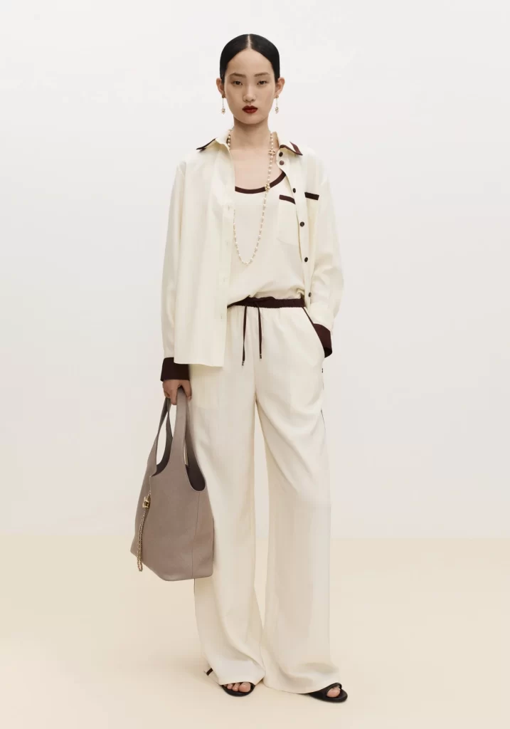 Chanel Spring Summer 2026 Pre Collection Look 19 Tweed Jacket and Trousers White and Brown Runway Photography