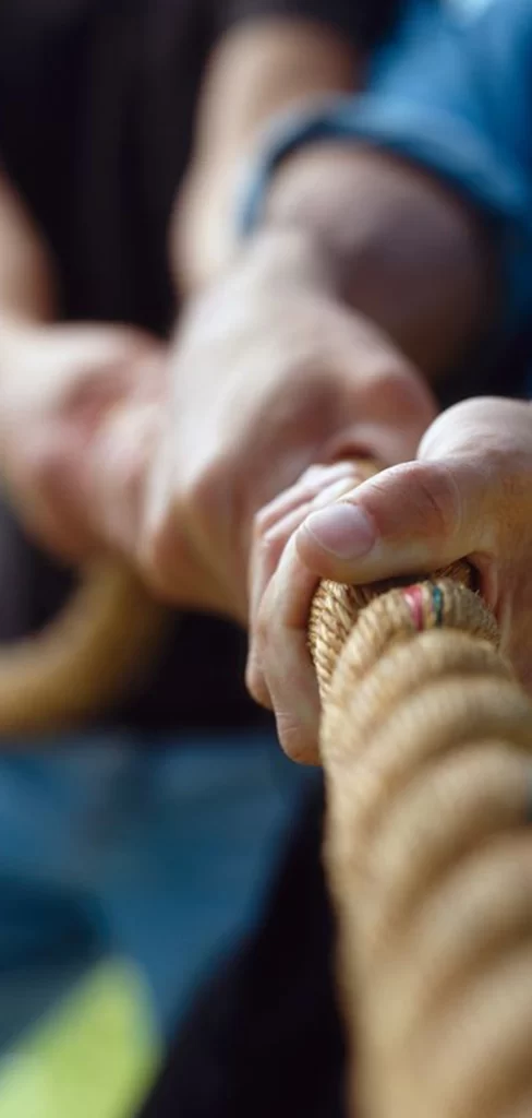 Hands Clasping Rope Outdoors