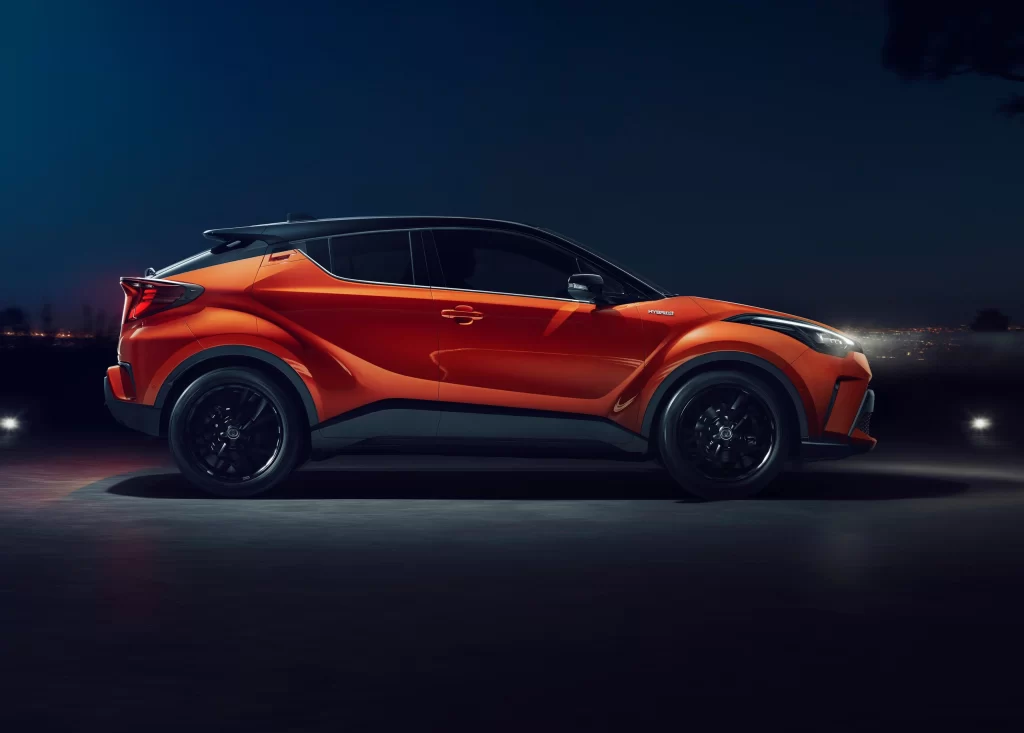 Orange Toyota SUV Road Side View