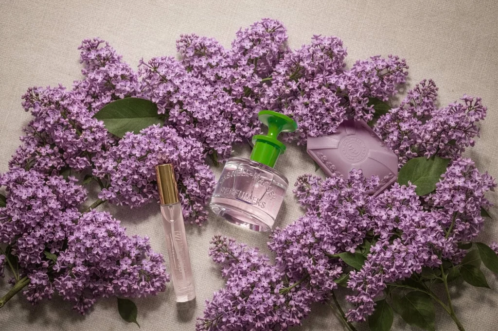 Perfume Among Lilac Flowers Bottle
